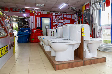 Toilet bowls in a plumbing store. Background with selective focus and copy space for text or lettering. Illustrative editorial. September 24, 2021 Balti Moldovaのeditorial素材