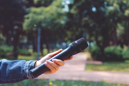 Microphone on blurred background with copy space for text or lettering, tonedの写真素材