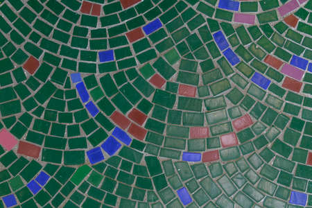 Mosaic elements in the old historical architecture of the urban environment. Rough textured background with copy space for text or lettering. Underlay blank or graphic design resourceの写真素材