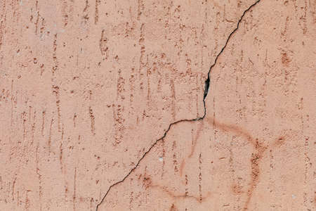 Scary shabby wall in grunge style. Rough textured surface. A background for a blank or a graphic resource for your design.の写真素材