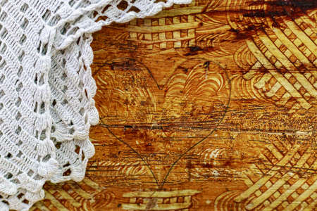 Rough wood surface with carved decor. Textured background. Blank for design. Underlay or undercoat....