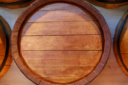Wine wooden barrels. Abstract background with selective focus and copy space for text or letteringの写真素材