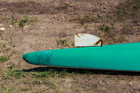 The bow of the kayak on land during the halt. Background with copy space for text. Amateur rafting.の写真素材