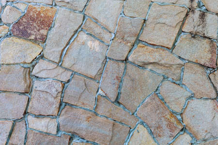 The rough surface of a wild decorative stone. Textured background. Blank for design. Underlay or...