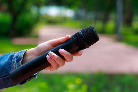 Microphone on blurred background with copy space for text or lettering, tonedの写真素材
