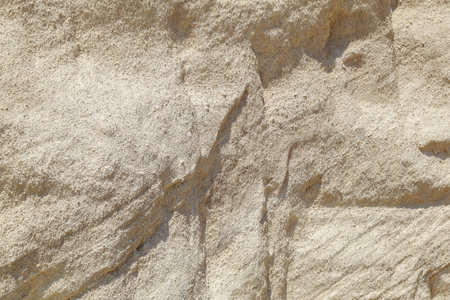 Natural limestone. Background for blank or graphic resource for design. Rough textured surface.の写真素材