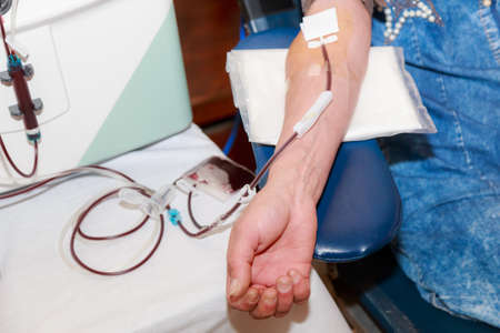 Volunteers donate blood. Public event for blood donor day. Background with copy space for text or lettering. Illustrative editorial. June 13, 2021, Balti Moldova.のeditorial素材