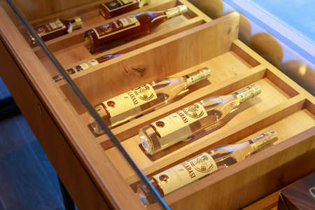 Elite luxury alcohol on the counter or showcase in a wine brandy store. Illustrative editorial. 25...