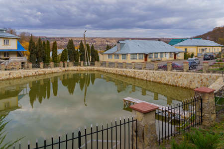 The area with a pond in a nunnery. Welcome to Moldova. Illustrative editorial. October 24, 2021 Kalarashovka Moldova.のeditorial素材