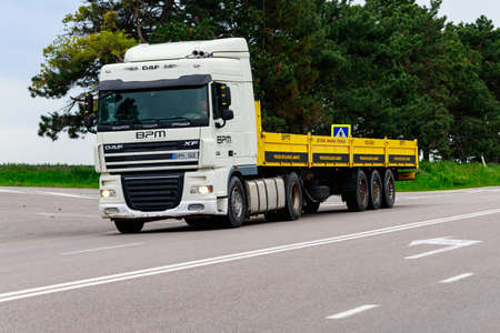 Trucks are carrying cargo. Background with copy space for text or inscriptions. Illustrative editorial. May 25, 2021 Balti Moldova.のeditorial素材