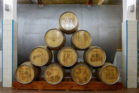 Dark cellar with barrels for aging luxury alcohol. Illustrative editorial. October 1, 2021 Balti...