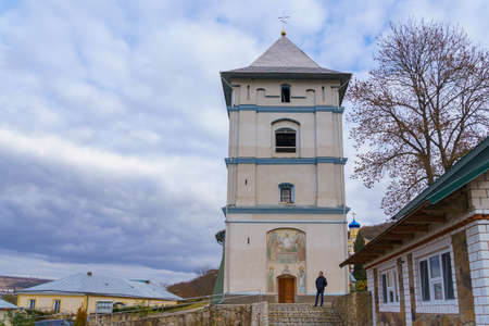 Tourist on an excursion to the Holy Dormition Convent. Welcome to Moldova. Illustrative editorial. October 24 2021, Kalarashovka Moldova.のeditorial素材