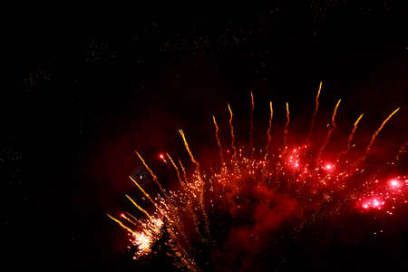 Very beautiful fireworks against the black sky with copy space for text or inscriptions. A graphic...