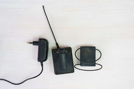 Monitoring system with an electronic bracelet. Penalty control gadget. Restriction of liberty and house arrest. Remote identification and location tracking.の写真素材