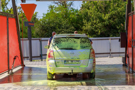 Modern city car wash. Background with copy space for text or lettering. Illustrative editorial. July 23, 2021, Balti Moldova.のeditorial素材