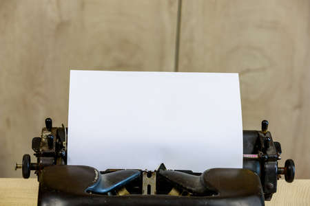 A sheet of paper in a classic vintage typewriter. Background with copy space for text or letteringの写真素材