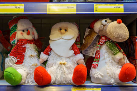 Soft Christmas symbolic toys on a store shelf. Background with copy space for text. Illustrative editorial. December 18, 2021 Balti Moldova.のeditorial素材