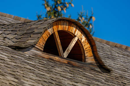 Old antique retro vintage authentic wooden window in the attic of a rustic moldovan house....