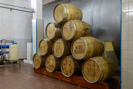Dark cellar with barrels for aging luxury alcohol. Illustrative editorial. October 1, 2021 Balti...