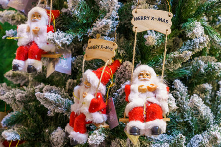 Soft Christmas symbolic toys Santa Claus on a store shelf. Background with copy space for text. Illustrative editorial. December 18, 2021 Balti Moldova.のeditorial素材