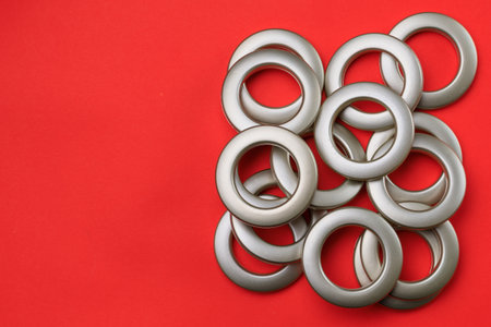 Matte eyelets for curtains on a bright colored background. Decor element for creating home comfort in interior design. Selective focusの写真素材