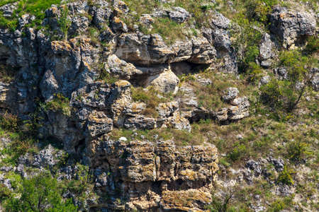 Wild rocky and mountainous nature of Eastern Europe. Landscape background with copy space for text. Selective focus, toned. The village of Tipovo or Tipova, welcome to Moldova.の写真素材