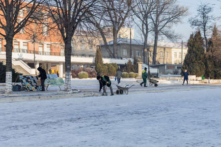 January 19, 2021 Balti or Beltsy, Moldova The work of janitors to remove snow in the city. Illustrative editorialのeditorial素材