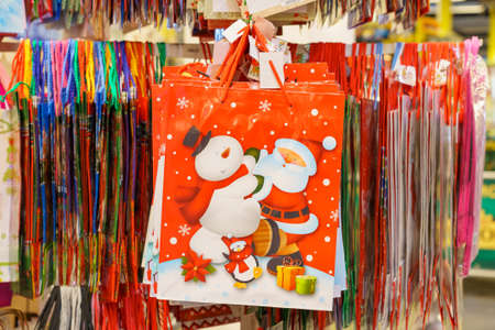 December 2, 2021 Balti Moldova. Illustrative editorial. Paper bags for Christmas gifts in a retail supermarket.のeditorial素材