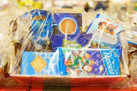 December 2, 2021 Balti Moldova. Illustrative editorial. Christmas sweet gift baskets at a retail grocery store.のeditorial素材