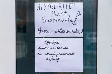 Two inscriptions in Russian and Romanian - The elections are suspended indefinitely, on the door of...