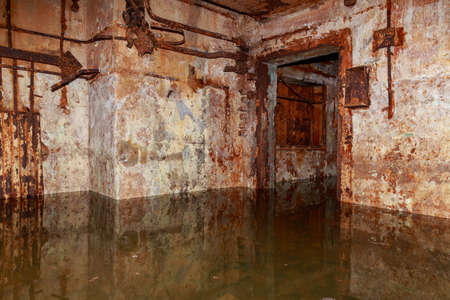 The interior of an underground anti nuclear abandoned secret military bunker. Creepy place, post apocalyptic background.の写真素材