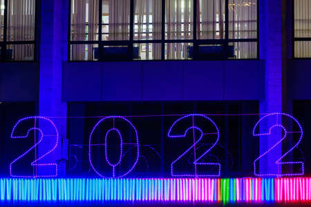 Glowing street Christmas or New Year garland in the form of numbers 2022. Background with copy space for text or inscriptionの写真素材