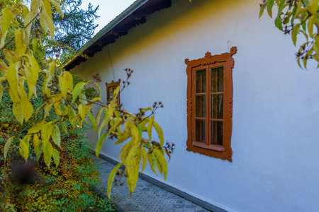 Old antique retro vintage authentic wooden window of a rustic moldovan house. Background with copy space for text.の写真素材