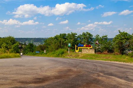 The column is a pointer to the entrance to the city. Illustrative editorial. June 28, 2021 Otaci Moldova. Backgroundのeditorial素材