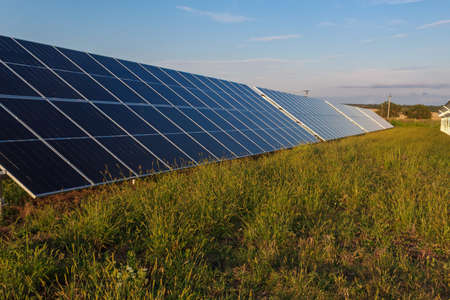 A complex of solar panels for generating electricity. Green energy farm. Background with copy space for text or inscriptions. Ecology concept.の写真素材