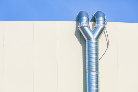 Industrial scale hood metal pipe. Infrastructure of the restaurants kitchen. Background with copy...