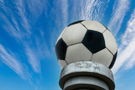 Monument to the classic black and white soccer ball. Background with copy space for textの写真素材