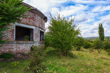 An abandoned pumping station by the river. Background with copy space for text