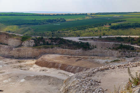 The operating huge quarry for the extraction of stone. Natural limestone. Background with copy space...