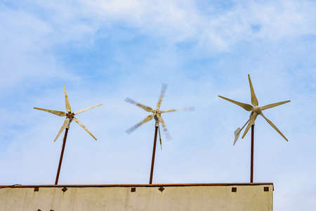 Small mini windmills for generating electricity in urban environments. Background with copy space