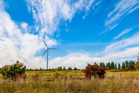 Windmills for electricity generation. Green energy concept. Background with copy space for text....