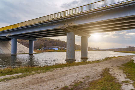 Automobile bridge over a small river. Background with copy space for textの写真素材