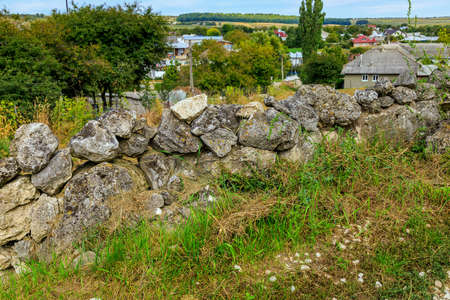 Authentic rustic stone fence without the use of cement or mortar. Background with copy space for...