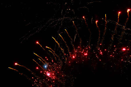 Very beautiful fireworks against the black sky with copy space for text or inscriptions. A graphic...