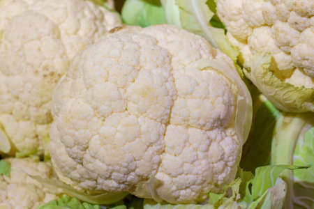 Farm organic fresh cauliflower. Natural vitamins in a retail grocery store. Selective focus with copy space for text.の写真素材