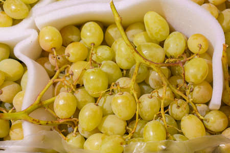 Farm organic grapes. Natural vitamins in a retail grocery store. Selective focus with copy space for...