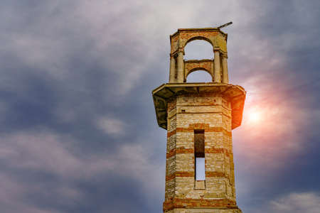 Old vintage ruined abandoned tower. Ruins of historical heritage. Travel background with copy space for text.の写真素材
