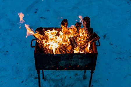 Brazier with fire and coals for cooking on the fire. Backgroundの写真素材