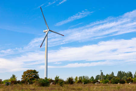 Windmills for electricity generation. Green energy concept. Background with copy space for text....