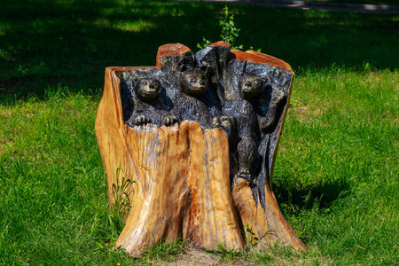 Carving and burning on wood. Unusual hobby. Carved bears as a symbol of good nature and strength.の写真素材